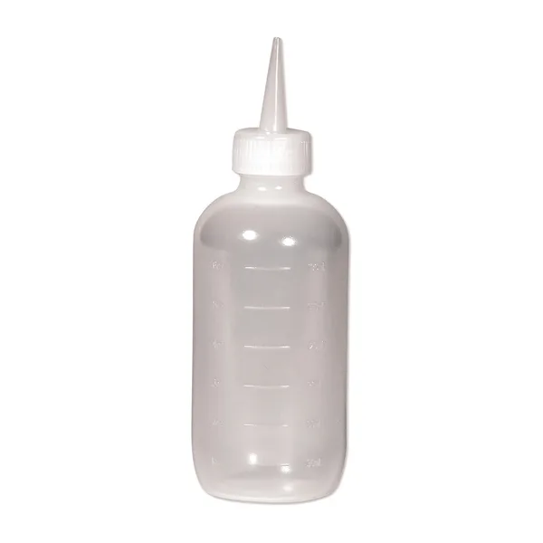 A clear applicator bottle with a nozzle tip
